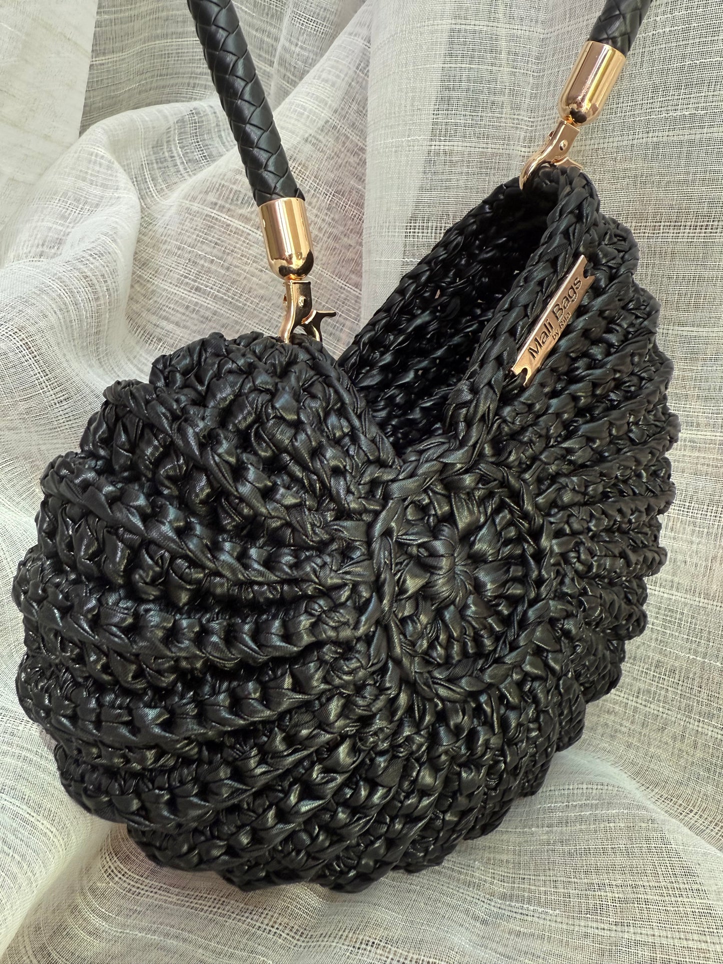 Ariel round shell black faux leather